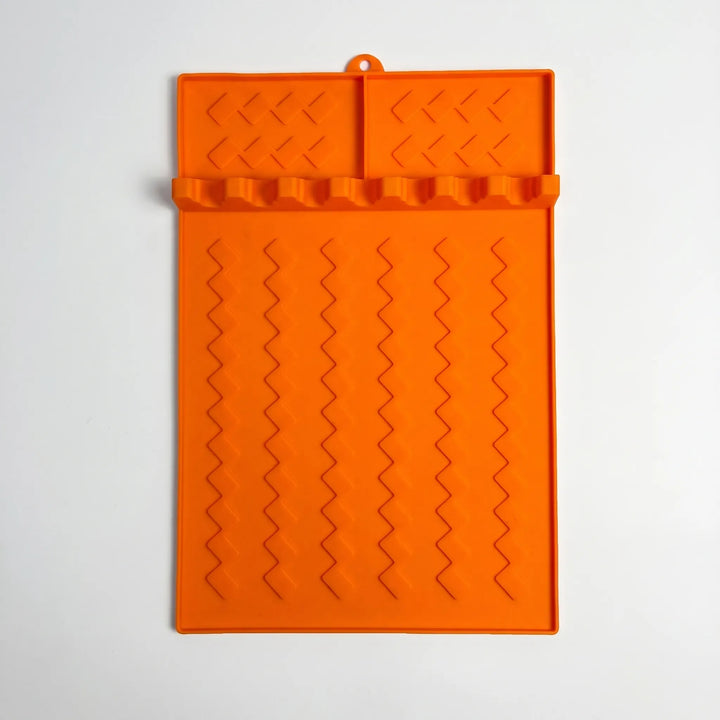 Versatile silicone cooking tool rest for BBQ accessories & kitchen utensils. Ideal spoon rest & drip mat.
