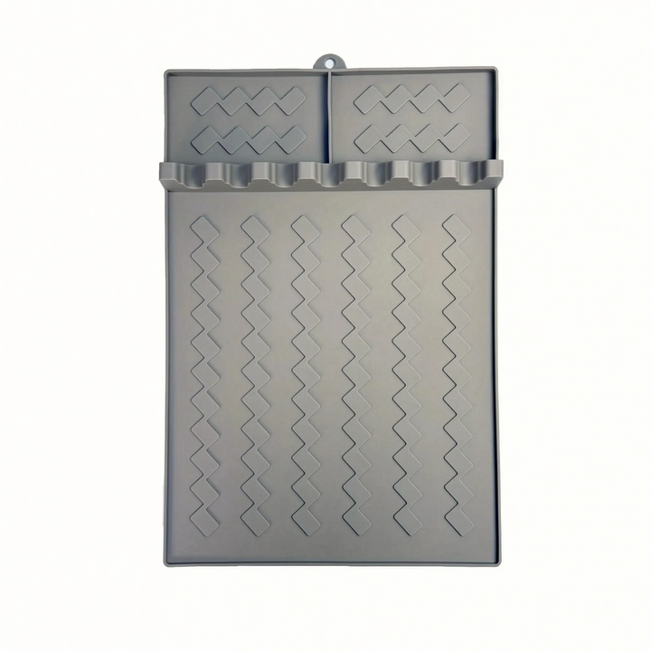 Mess-free silicone grill utensil rest pad for BBQ and kitchen tools. Prevents drips, keeps counters & grill clean.
