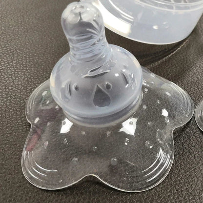 Flexible silicone nipple shield, safe for baby, offering protection & aid for sensitive nipples during feeding.