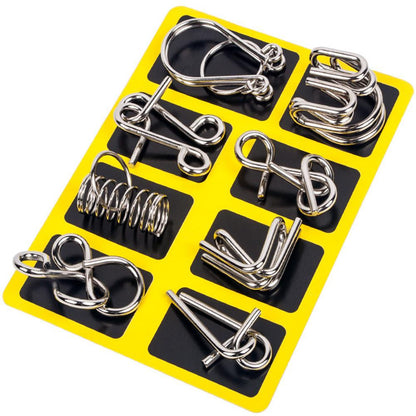 Detailed view of a disassembled metal interlocking puzzle, highlighting its complex design