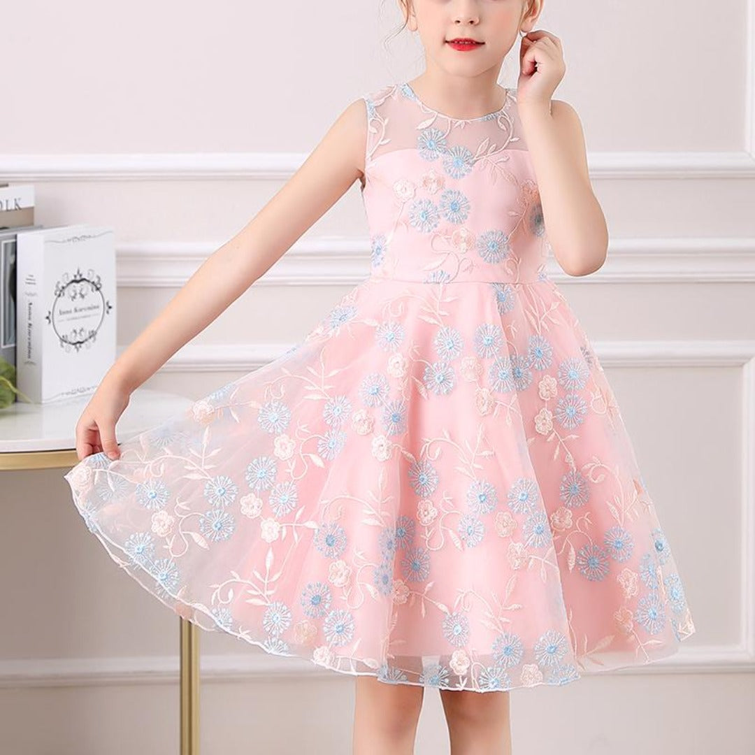 Elegant children's party gown with delicate floral embroidery and lace details.