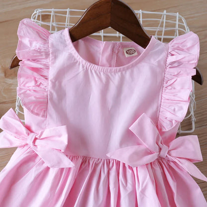 Children's clothing: pink summer dress with a big bow, sleeveless design