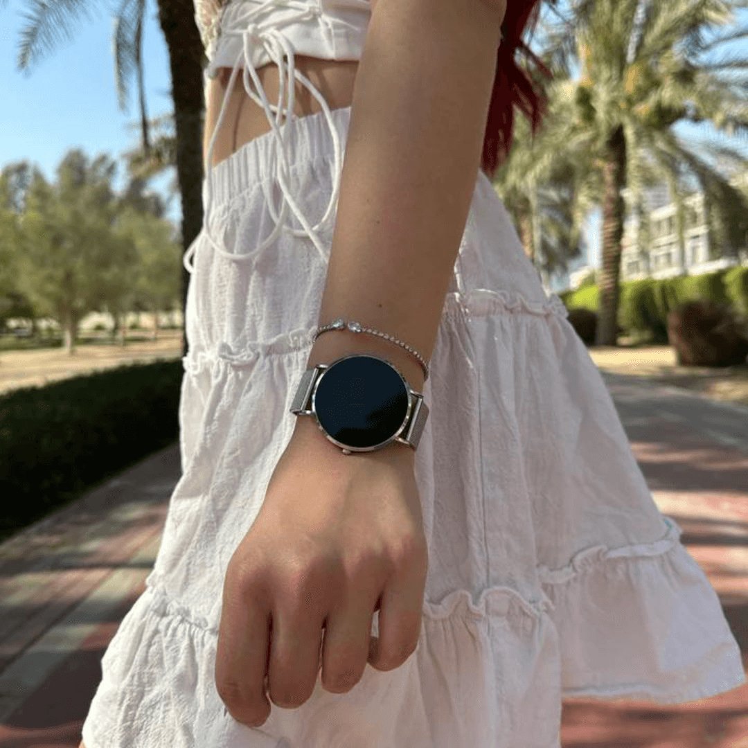 Women's slim rose gold smartwatch on a wrist, demonstrating its elegant and discreet wearable tech look.