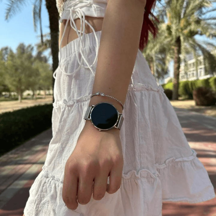 Women's slim rose gold smartwatch on a wrist, demonstrating its elegant and discreet wearable tech look.