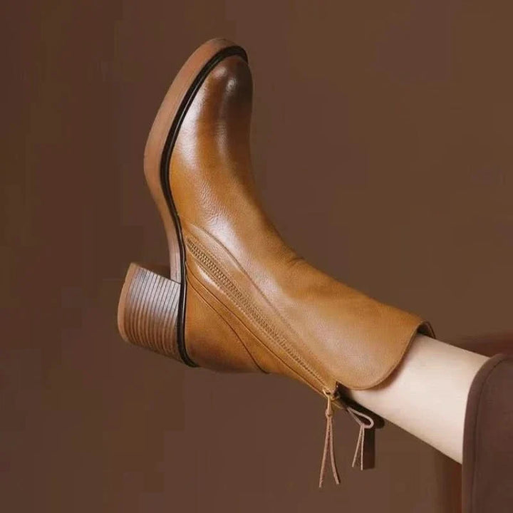 Sloane women's black high-heel ankle boots. Stylish & sophisticated for fall/winter fashion.