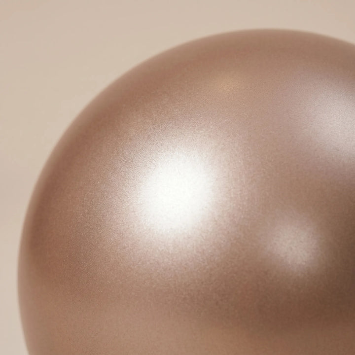 Unisex Pilates ball for home workouts, enhancing flexibility, balance, and core stability.
