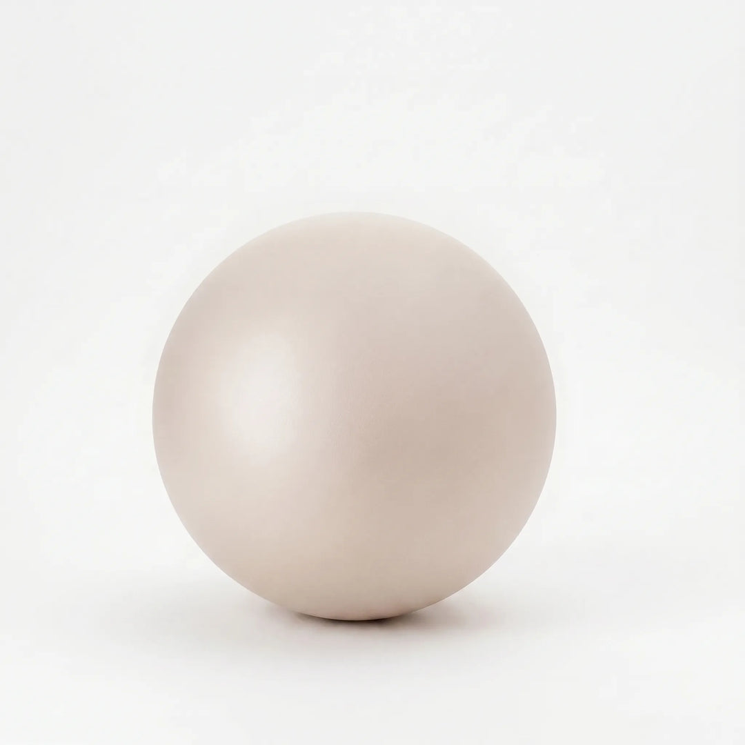 Small fitness ball for yoga, core exercises, and home gym use. Unisex, perfect for stretching.