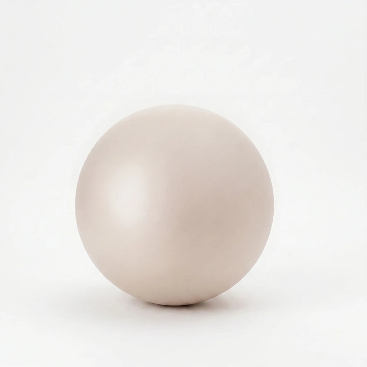 Small fitness ball for yoga, core exercises, and home gym use. Unisex, perfect for stretching.