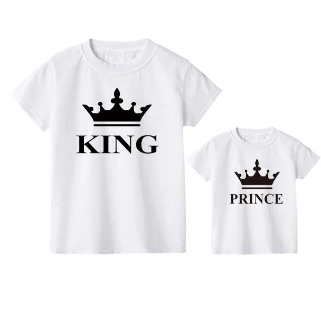 Father's hand on son's shoulder, both wearing matching 'The Original' & 'The Remix' t-shirts, family bond.