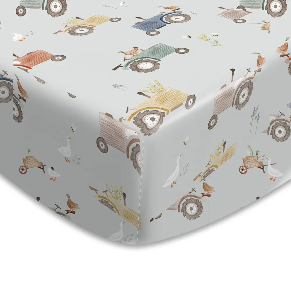 Breathable baby crib sheet with playful cartoon animals, natural cotton.