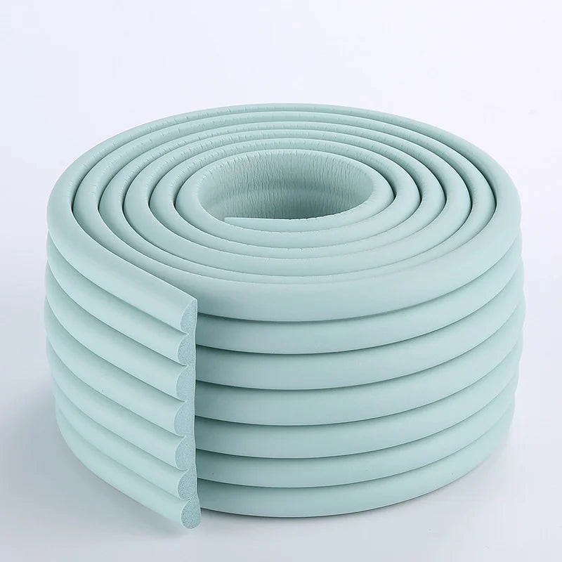 Gray foam edge protector strip, a soft bumper for child proofing furniture.