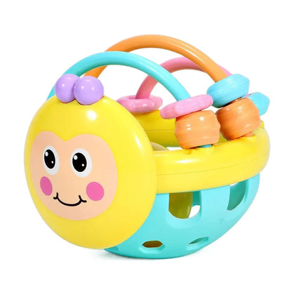 Close-up of a baby's hand grasping a soft sensory teether rattle ball, newborn developmental toy.