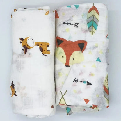 Stack of folded bamboo cotton muslin swaddle blankets in various gentle colors, baby essentials