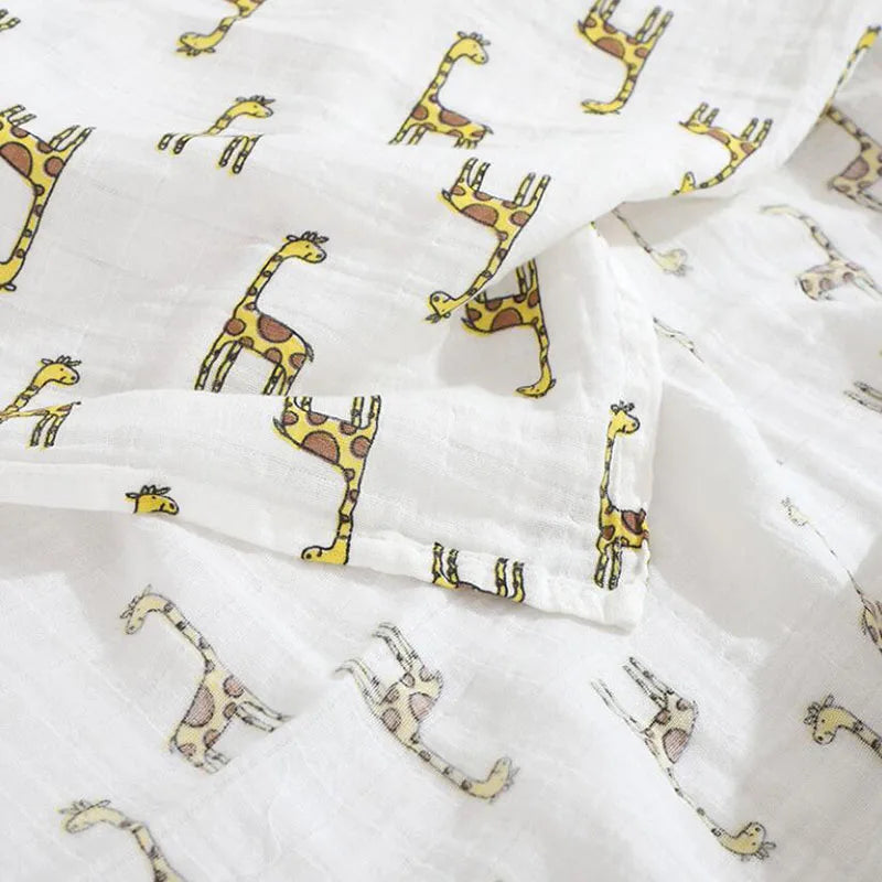 Versatile bamboo cotton muslin baby blanket draped over a stroller as a breathable cover