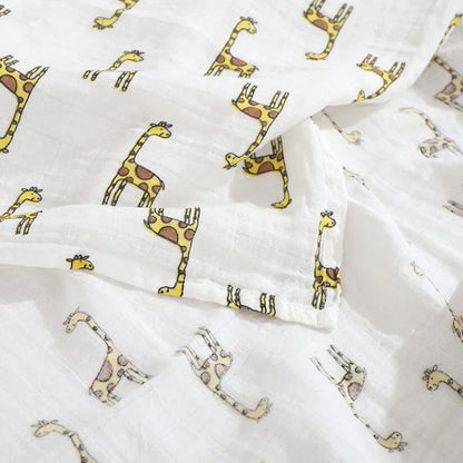 Versatile bamboo cotton muslin baby blanket draped over a stroller as a breathable cover