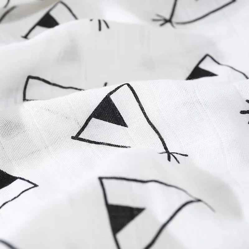 Close-up of the breathable weave and soft texture of a bamboo cotton muslin swaddle blanket