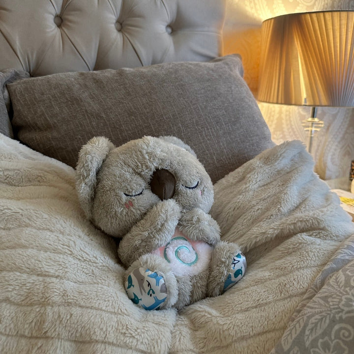 Cuddly Koala plush calming toy & breathing aid for kids, provides stress relief & promotes peaceful sleep.