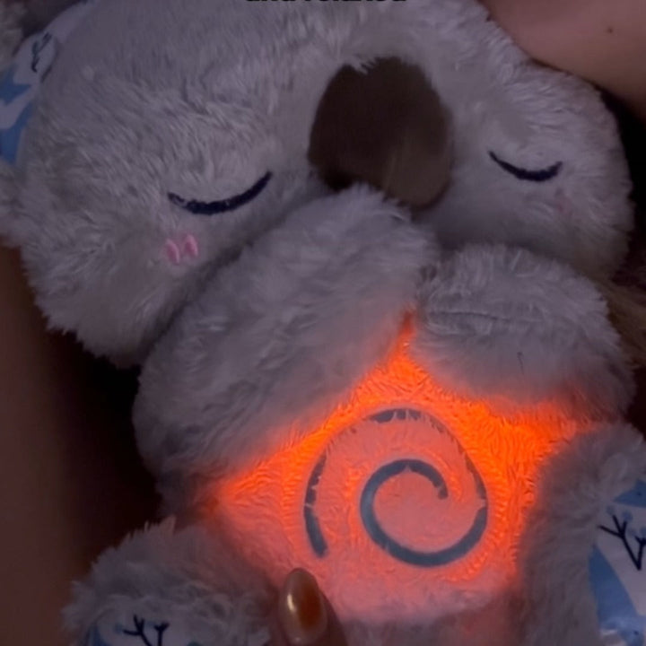 Calming Koala breathing sleep aid plush, anxiety relief toy with soft light for relaxation & better sleep.