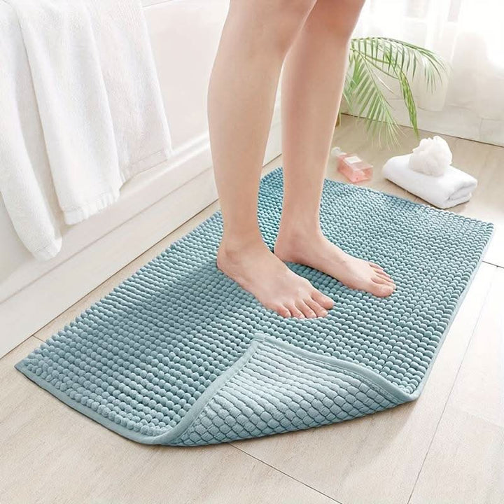 Non-slip backing of a chenille bath rug, ensuring safety and stability on wet bathroom floors. Highly absorbent.
