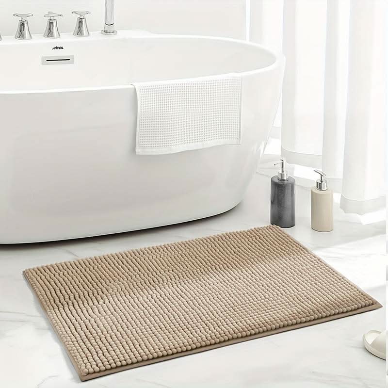 Thick, plush chenille bath rug, an ultra-absorbent and non-slip floor mat, providing comfort and safety for bathrooms.