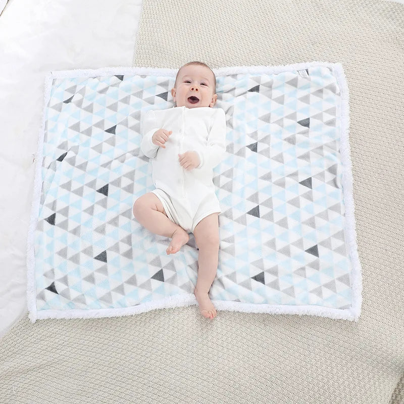 Unisex coral fleece blanket, ideal stroller & crib accessory.