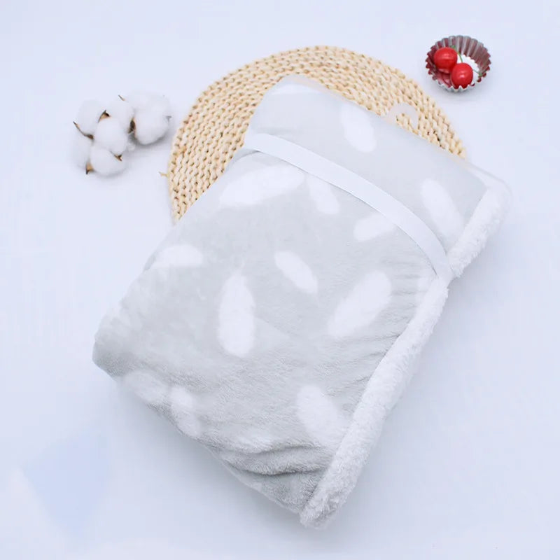 Luxurious coral fleece blanket, a cozy baby shower gift.