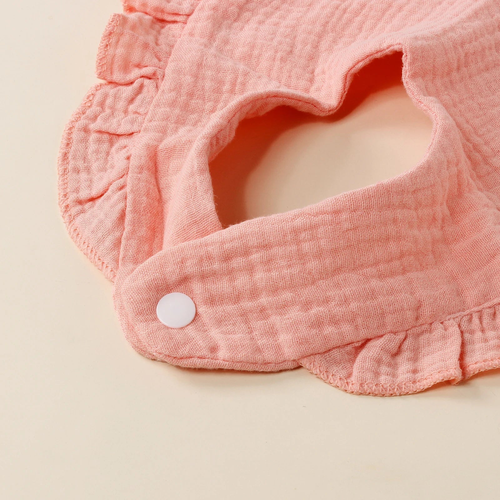 Durable cotton feeding bib for active toddlers, stain-resistant and soft, essential baby accessory.