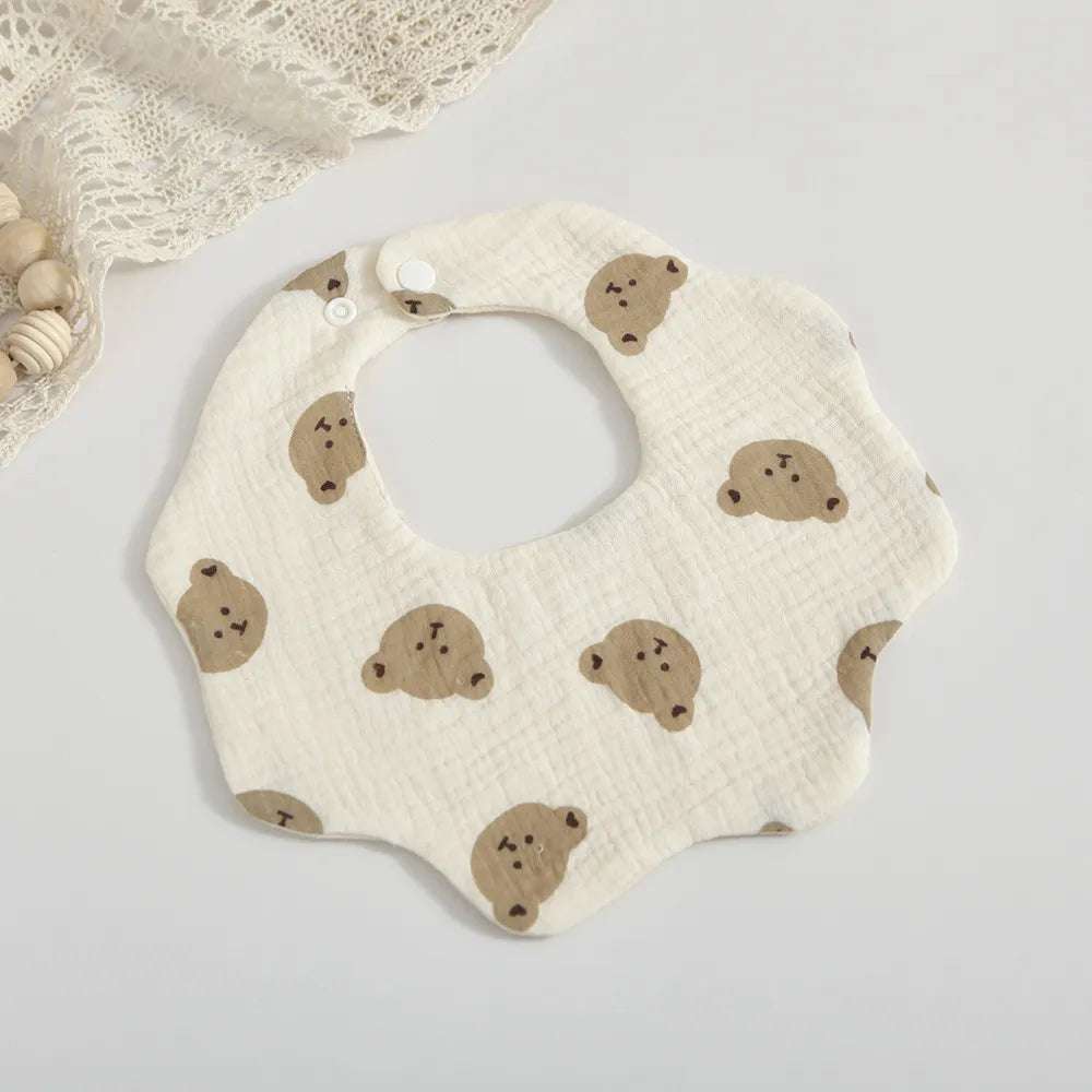Stylish baby feeding bib featuring an exclusive petal print design, made from premium absorbent cotton