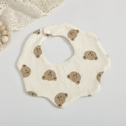 Stylish baby feeding bib featuring an exclusive petal print design, made from premium absorbent cotton