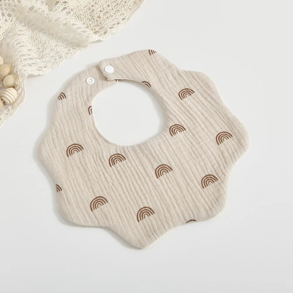 Baby bibs for mealtime: a durable and soft cotton petal print bib, designed for frequent use
