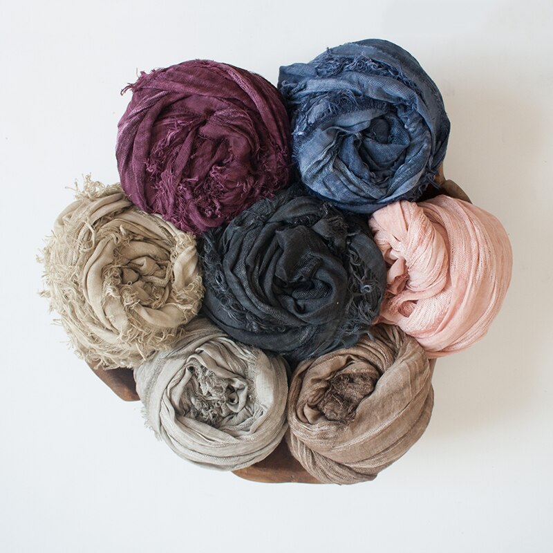 Gift set with a soft cotton baby swaddle blanket, essential baby accessories