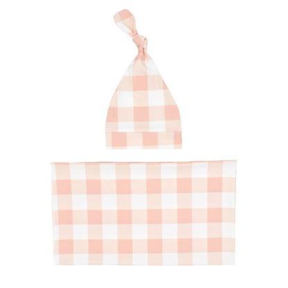 Newborn infant swaddle blanket in classic plaid pattern with coordinating baby hat, cozy comfort.