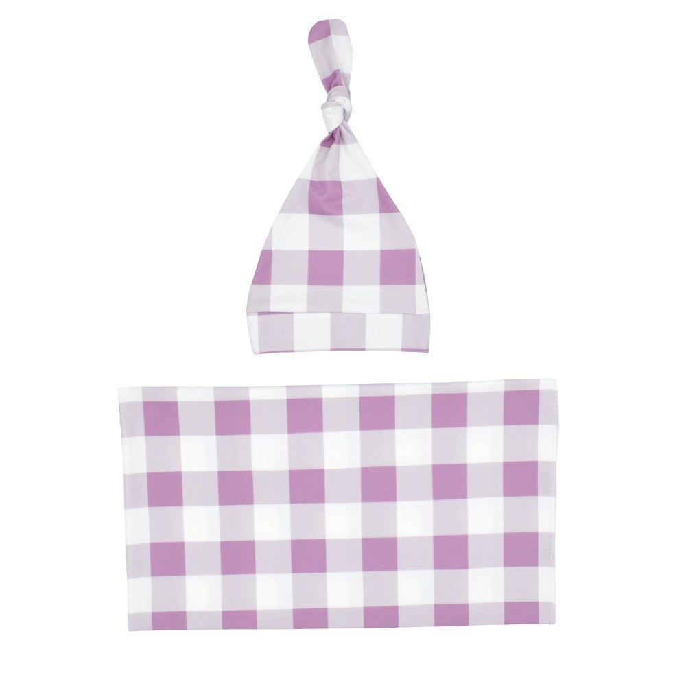 Plaid baby swaddle and knotted hat set, ideal baby shower gift for new parents.
