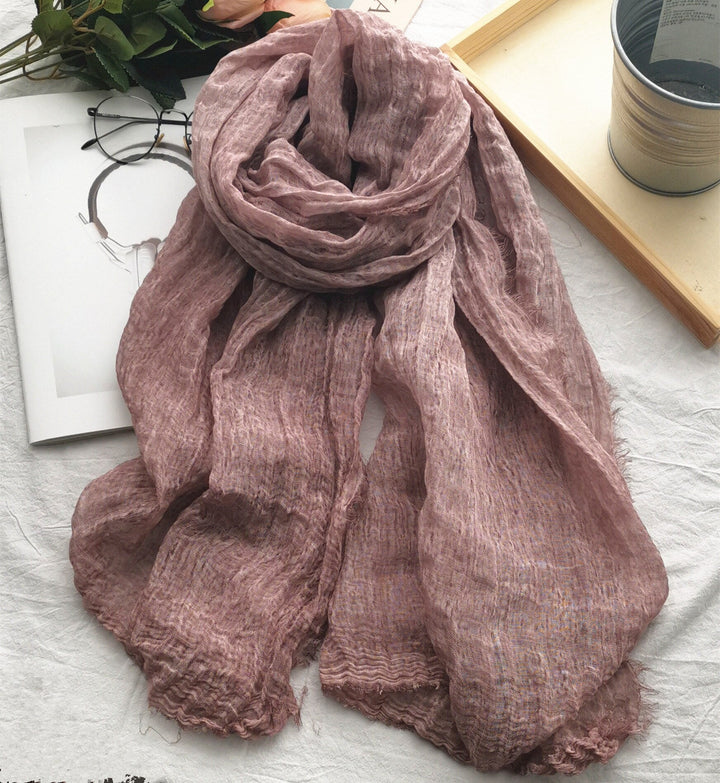 Ideal baby shower gift: a soft, neutral cotton linen infant wrap and photography prop.