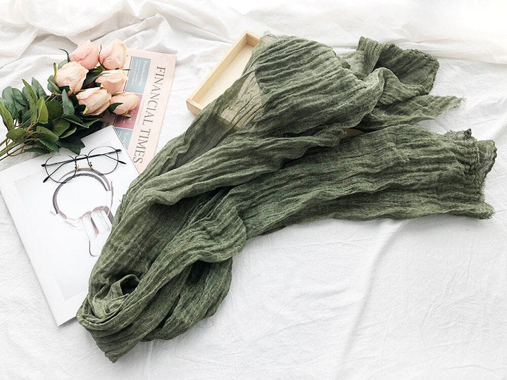 Neutral cotton linen baby wrap, a stylish photography backdrop for infant photo shoots.
