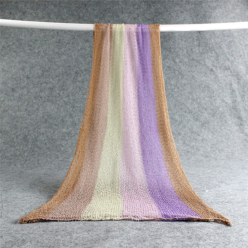 Versatile newborn swaddle blanket, soft stretchy cotton for comforting wrap or photography.