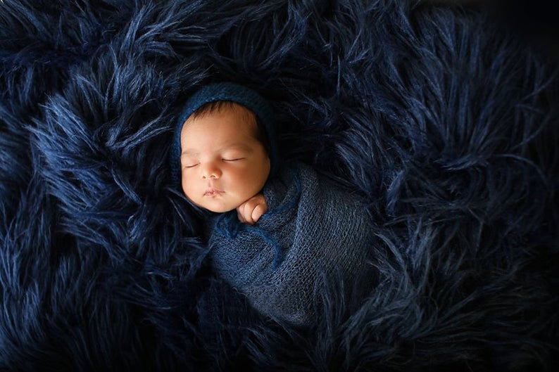Luxurious knit newborn photography blanket, a thoughtful baby shower gift for new parents.