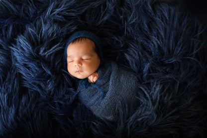 Luxurious knit newborn photography blanket, a thoughtful baby shower gift for new parents.