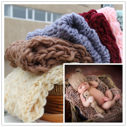 Baby photo prop: machine washable cream crochet blanket for easy care.