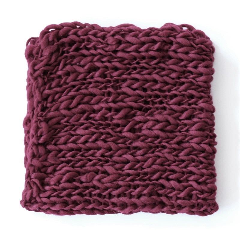 Close-up of soft textured crochet blanket, a newborn photo accessory.
