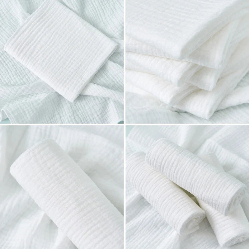 Newborn baby wearing a soft, white reusable cotton gauze diaper, gentle on skin