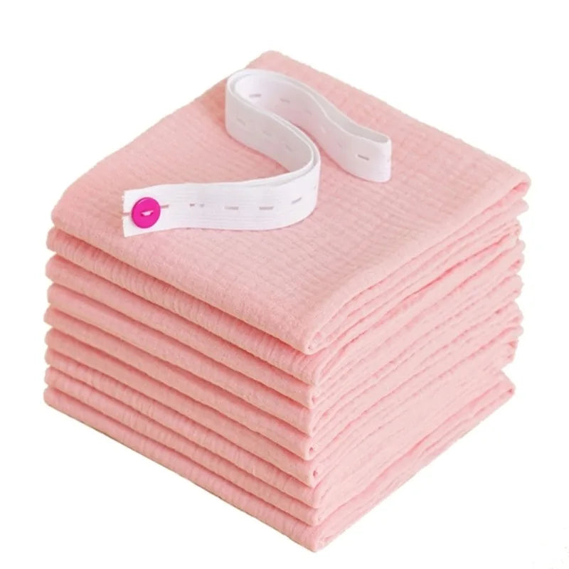 Hand holding a clean, washable cotton gauze diaper, showcasing its softness and texture
