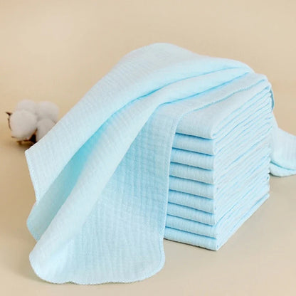 Line of drying reusable cotton gauze diapers, highlighting their washable nature