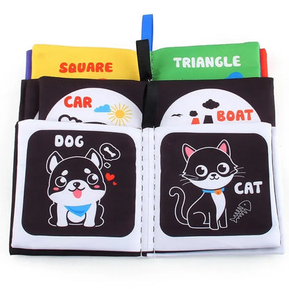 Toddler happily turning pages of a colorful soft learning book, engaging baby activity toy