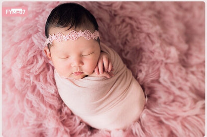 Ultra-soft faux fur baby blanket in white, essential for memorable photo shoots