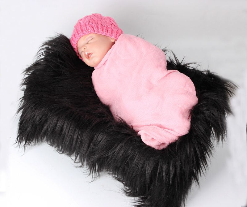 Fluffy faux fur baby blanket, a must-have accessory for newborn photographers