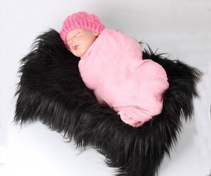 Fluffy faux fur baby blanket, a must-have accessory for newborn photographers