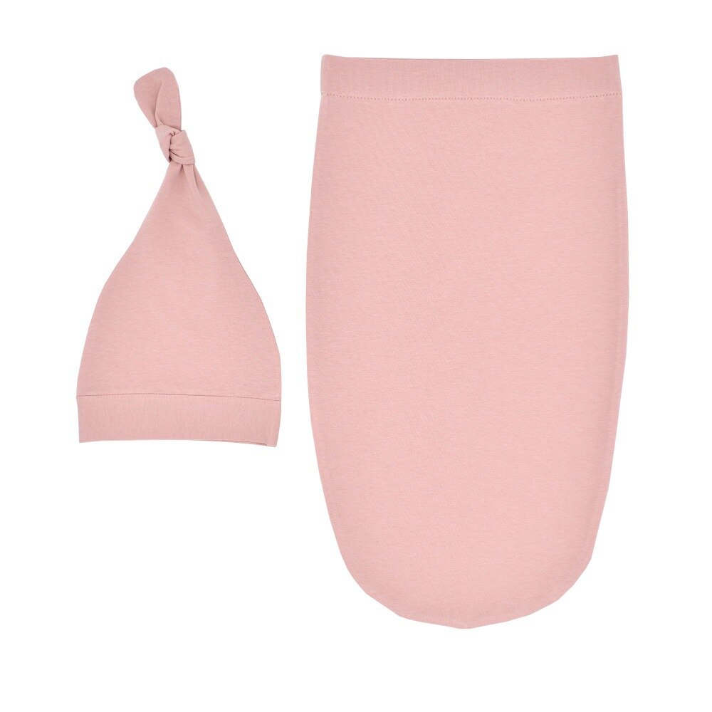 White infant sleeping bag and hat set, perfect for a newborn photoshoot or daily use