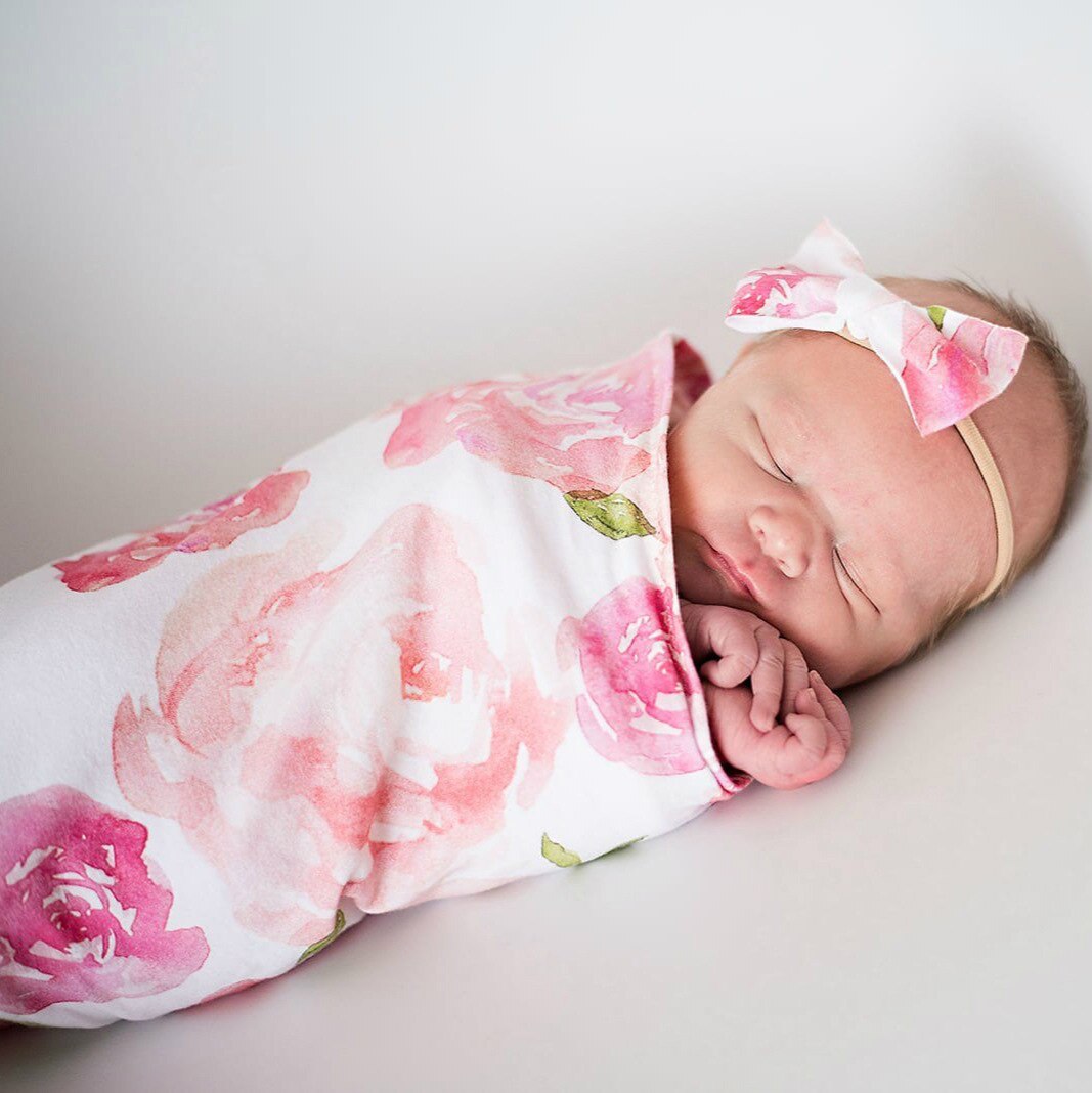 Neutral infant swaddle sleeping bag and cap, a practical baby gift for baby showers