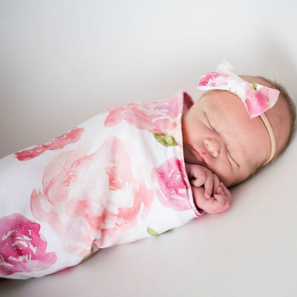 Neutral infant swaddle sleeping bag and cap, a practical baby gift for baby showers